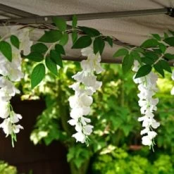 Solar Powered 180cm Artificial Leaf Garland With Wisteria Flowers - Warm White -Magic Garden 379258 180cm solar powered artificial leaf garland with wisteria flowers 20 warm white micro leds